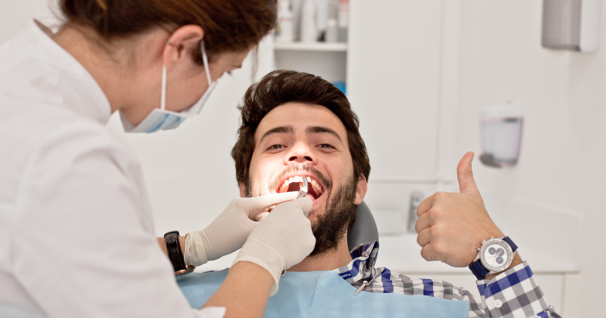 Man getting tooth extraction at dental clinic in Mount Pleasant, SC